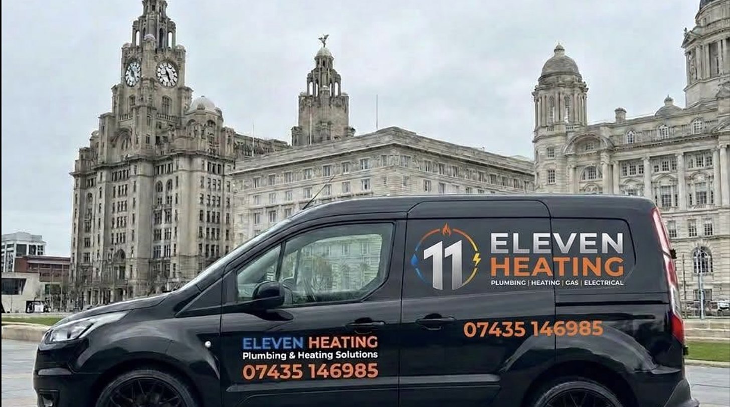 Heating engineer working on a central heating manifold
