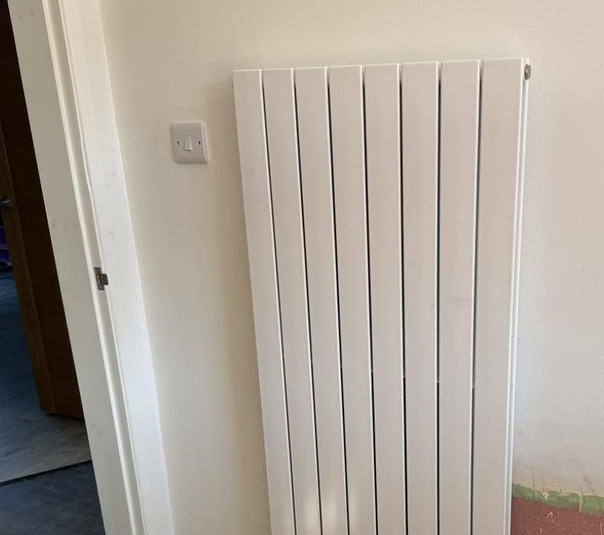 Vertical designer radiator installed by Gibson Mechanical Solutions